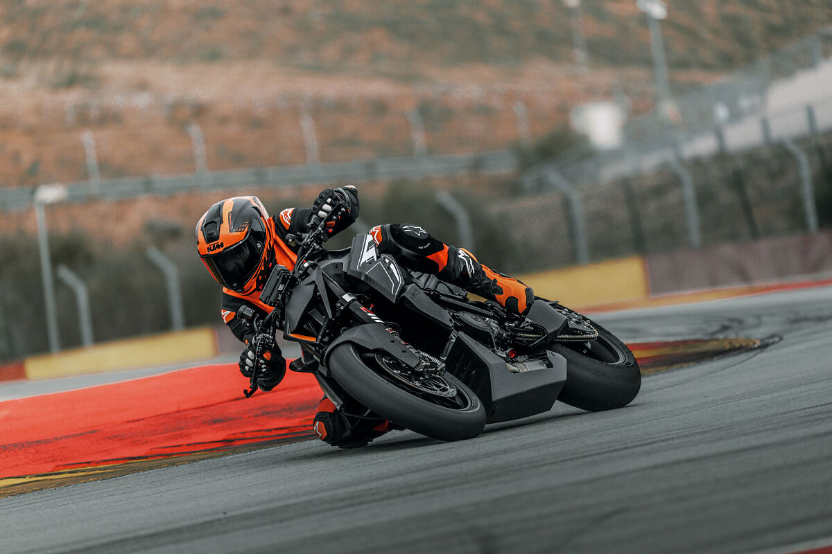2026 KTM 1390 Super Duke RR Track leaning through a corner on slick tires