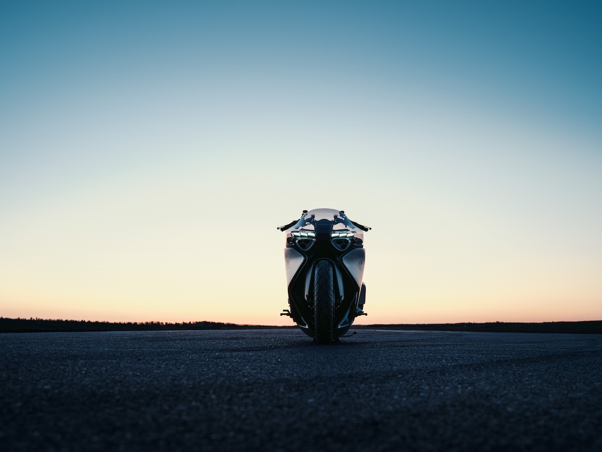 BMW Motorrad Vision K18 head-on view on runway at sunset showing six LED headlights