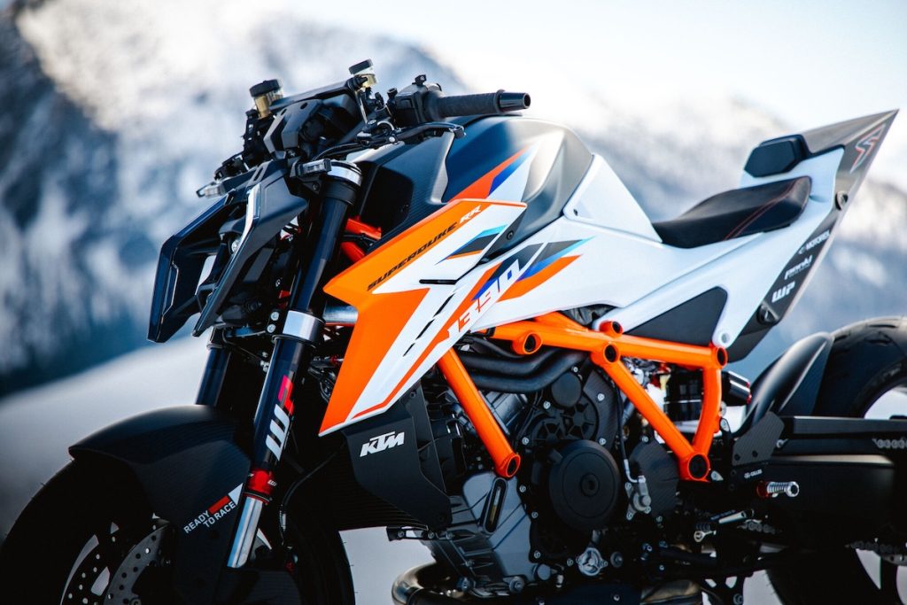 2026 KTM 1390 Super Duke RR right-side close-up showing carbon bodywork orange trellis frame and WP PRO COMPONENTS forks