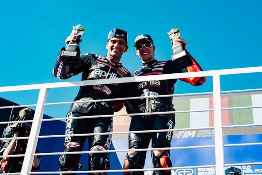Marco Bezzecchi and Jorge Martin on the Brazilian MotoGP 2026 podium after Aprilia Racing first 1-2 in premier-class history at Goiania