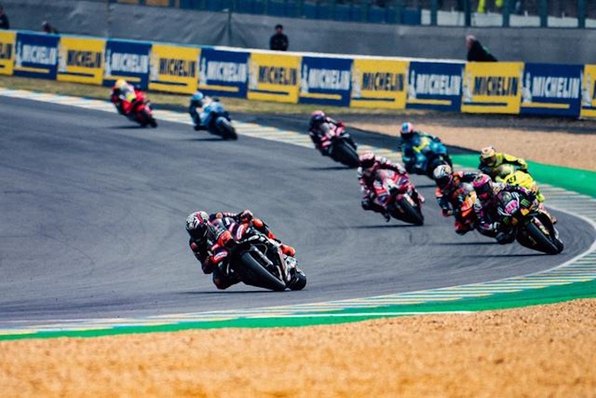 An Aprilia rider sweeps through the Bugatti circuit during the 2026 French MotoGP at Le Mans